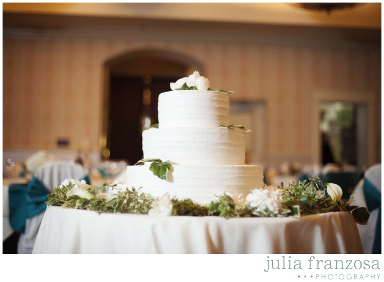 Simple white cake at wedding reception is perfect.